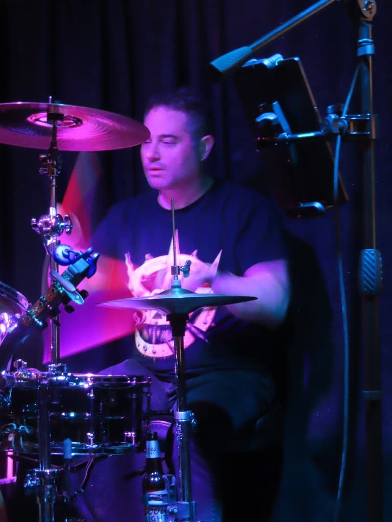Ira Siegel playing drums at a Rock Steady show
